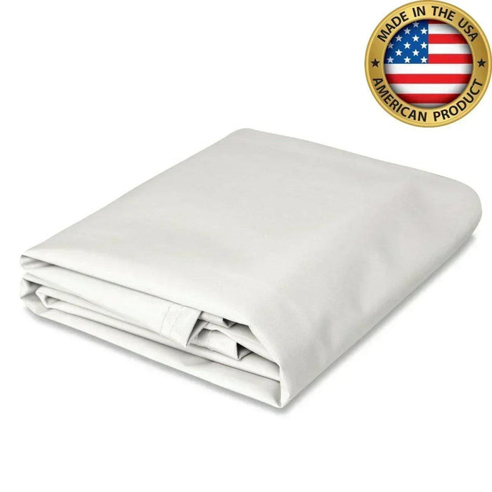 White 10' x 16' 18oz vinyl tarp providing industrial duty coverage