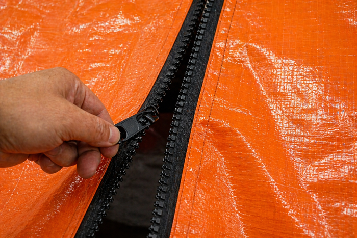 Black 7' x 3" heavy duty tarp zipper kit showing zipper installation closeup