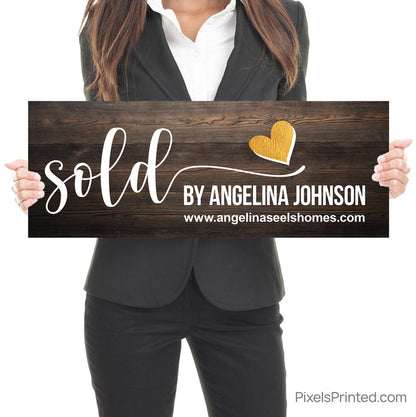 closing photo sign with homeowners sold by realtor with gold heart