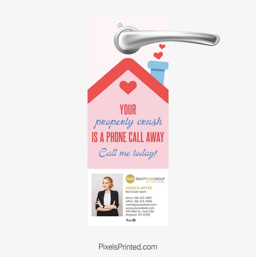 Realty ONE Group Valentine door hanger saying “Your property crush is a phone call away”